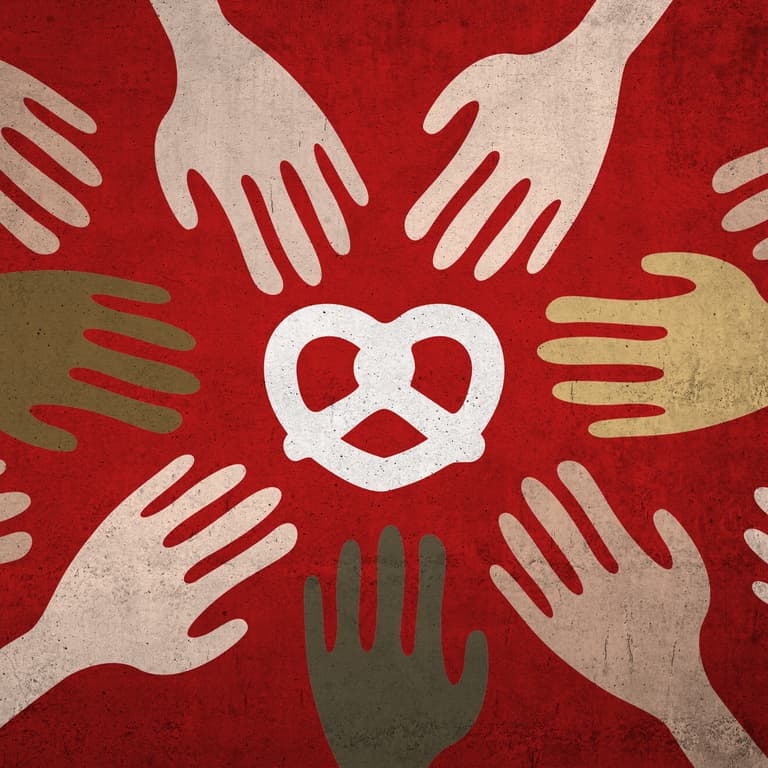 Grafik mit Brezen und Händen auf roter Wand